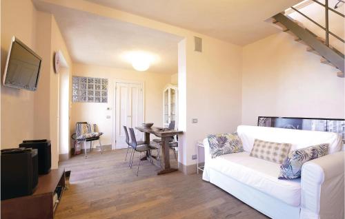 a living room with a white couch and a table at S Rocco Dimora Tra Ulivi E M in Zoagli