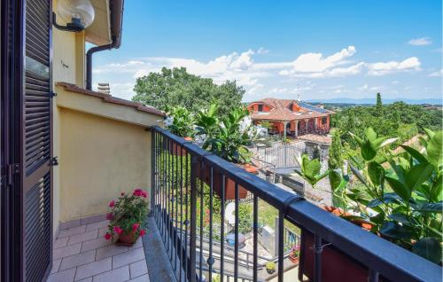 a balcony with a view of a house at Stunning Apartment In Montefiascone in Montefiascone