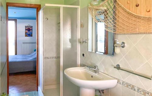 a bathroom with a sink and a shower at Stunning Apartment In Montefiascone in Montefiascone