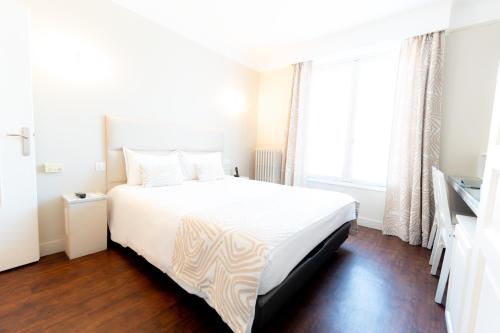 Postel nebo postele na pokoji v ubytování Hotel d'Angleterre