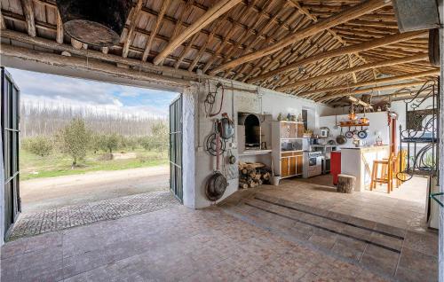 an open door to a kitchen in a building at Nice Home In Trasmulas, Granada in Trasmulas