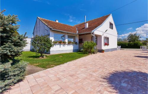 a white house with a brick driveway at Pet Friendly Home In Gudovac With Wifi in Gudovac