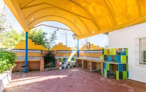 a building with an arch with colorful tiles on it at 6 Bedroom Amazing Home In Lucena in Lucena