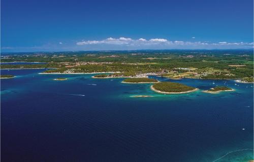 an aerial view of a group of islands in the water at Lovely Home In Funtana With Sauna in Funtana