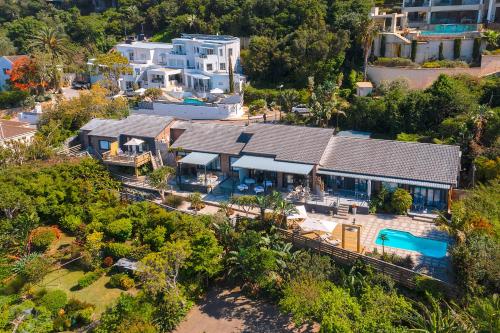 an aerial view of a house with a swimming pool at THEBLOEM Guest Suites by Knysna Paradise Collection in Knysna