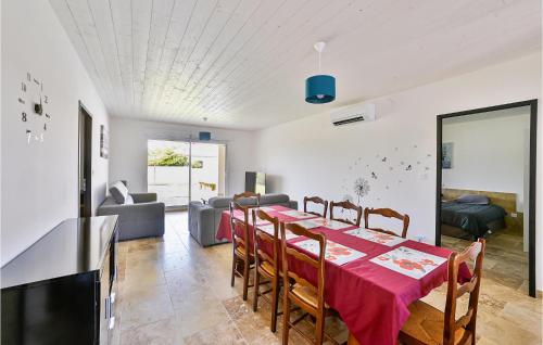 a dining room with a red table and chairs at Stunning Home In Saint-Theodorit in Saint-Théodorit