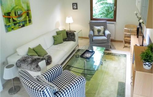 a living room with a couch and two chairs and a glass table at 3 Bedroom Beautiful Home In Kirchheim in Kirchheim