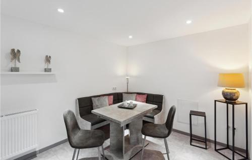 a dining room with a table and chairs at 1 Bedroom Lovely Apartment In Nieheim in Nieheim