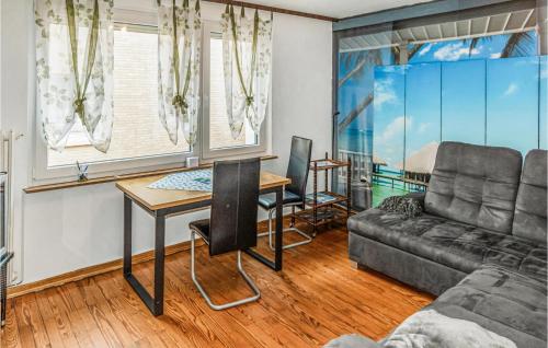 a living room with a couch and a table at Nice Apartment In Helgoland With Wifi in Helgoland