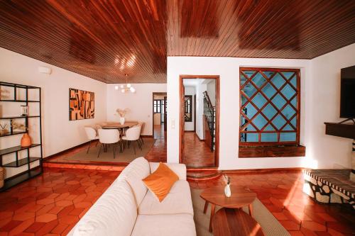 a living room with a couch and a table at Casa da Laranja by Quantique in Peso da Régua