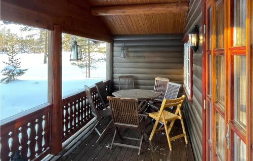 a porch with a table and chairs on it at 5 Bedroom Pet Friendly Home In Jordet in Jordet