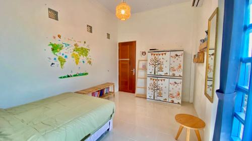 Кровать или кровати в номере Rooftop Suites Pusat Kota Pontianak