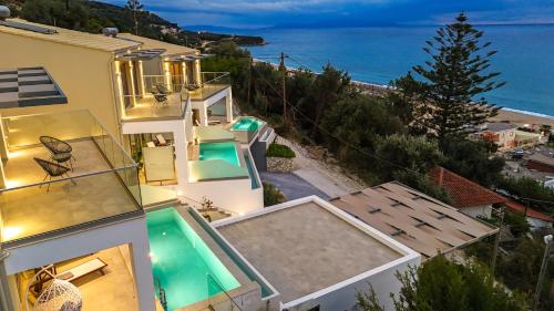 an image of a house with a view of the ocean at Anassa Villas in Vráchos