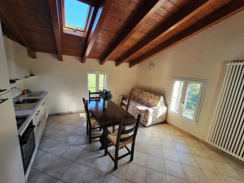 a living room with a table and a couch at Podere Elisa in Vezzano sul Crostolo