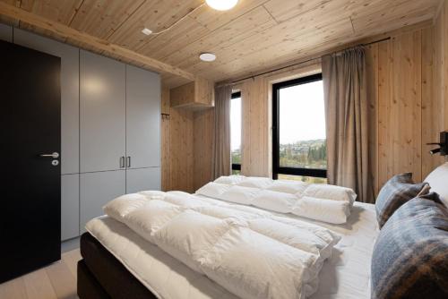 Postel nebo postele na pokoji v ubytování Mosetertoppen Skistadion - Hafjell Ski Resort