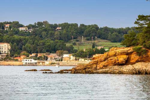 a view of a body of water with a town at chambre d'hote luxe vue mer boheme in Le Pradet