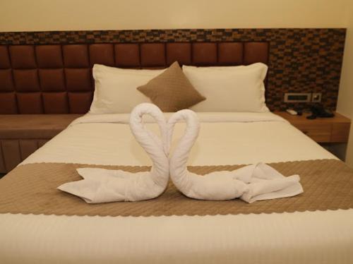 Ένα ή περισσότερα κρεβάτια σε δωμάτιο στο Hotel Jia International