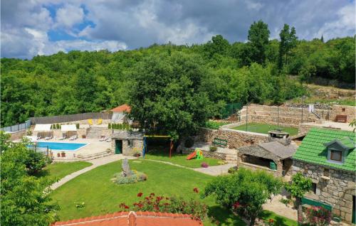 an aerial view of a house with a yard at Holiday Home Zmijavci I in Zmijavci