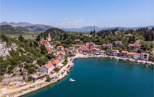 an aerial view of a small town on a lake at 1 Bedroom Nice Home In Rogotin in Rogotin