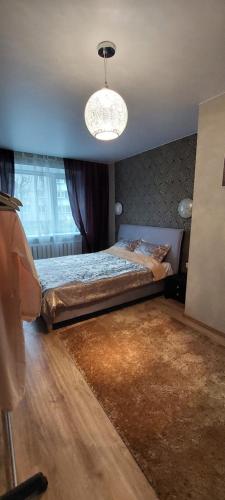 Postel nebo postele na pokoji v ubytování герасимова 12