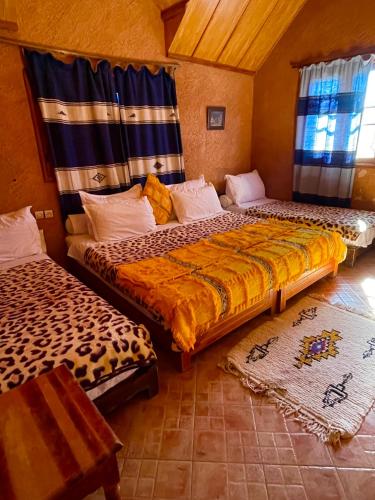 Ein Bett oder Betten in einem Zimmer der Unterkunft Ferme D’hôte La Vallée