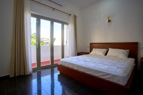 En eller flere senge i et værelse på The Retreat Minimum 3 Nights