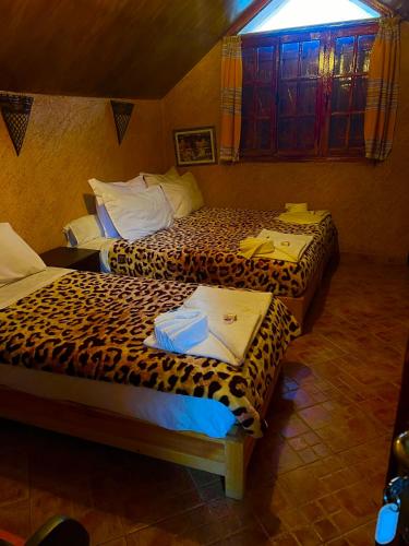Ein Bett oder Betten in einem Zimmer der Unterkunft Ferme D’hôte La Vallée