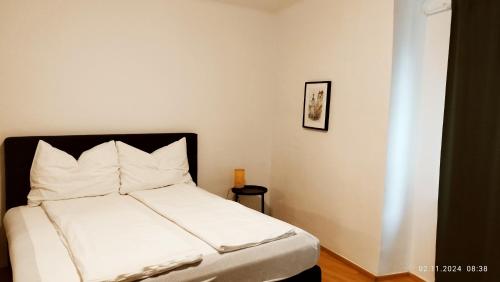 Postel nebo postele na pokoji v ubytování Hagmann's Altstadt Appartement 1