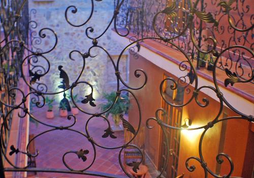 a view of a wrought iron fence with a window at La Isabela Suites in Panama City