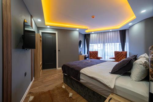 a hotel room with a bed and a television at Viv City Hotel in Istanbul
