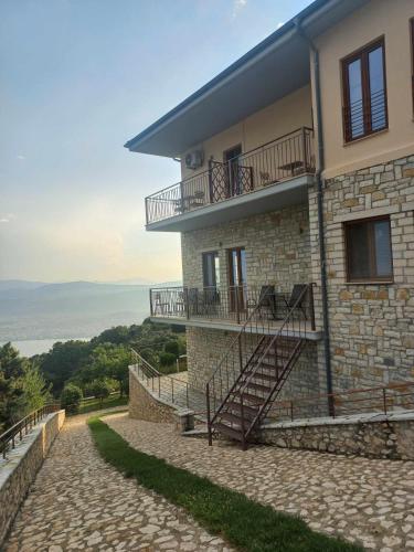 a building with stairs on the side of it at Arktos Hotel in Ioannina