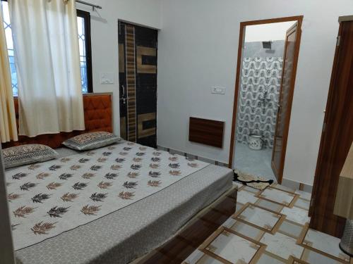 Postel nebo postele na pokoji v ubytování Omisha Guest House