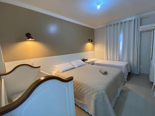 Katil atau katil-katil dalam bilik di Faixa Hotel