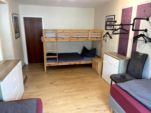 a room with two bunk beds and a desk at Monteur & Geschäftsreisen Stay in Günsterode