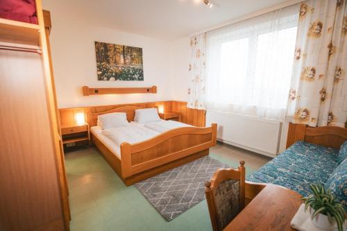 Postel nebo postele na pokoji v ubytování Gasthaus Bauer