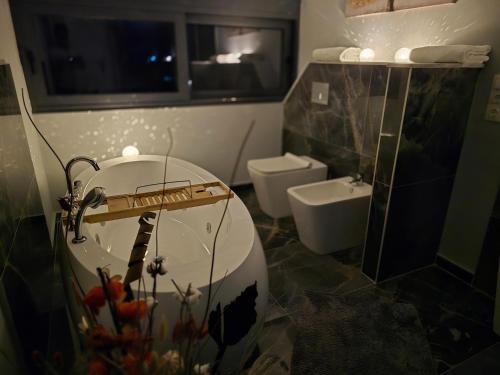 a bathroom with a sink and a toilet at Villa Aurelia Privat Pool in Kolimbia