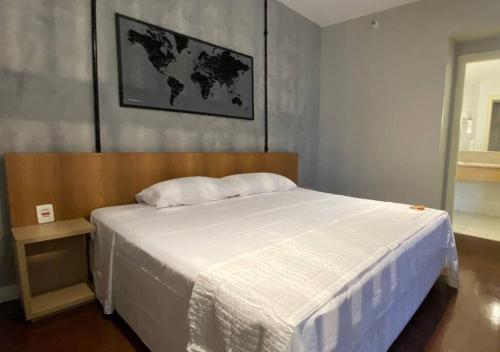 Ένα ή περισσότερα κρεβάτια σε δωμάτιο στο lindo flat no mercure