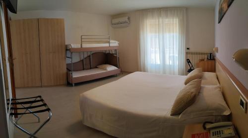 Postel nebo postele na pokoji v ubytování Hotel Eliani