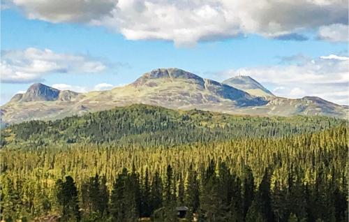 a mountain range with trees and mountains in the background at Nice Home In Tuddal With Kitchen in Tuddal
