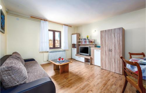 a living room with a couch and a table at 1 Bedroom Stunning Apartment In Kastel in Kaštel