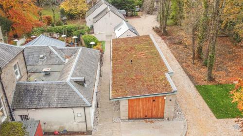 an overhead view of a house with a roof at Bankton Rooms & Lodges in Livingston