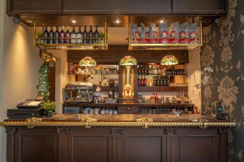a bar with a lot of bottles of alcohol at Bankton Rooms & Lodges in Livingston
