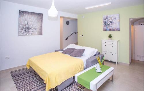 a bedroom with a bed and a table in it at Villa Orljak in Buzet