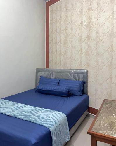 Ένα ή περισσότερα κρεβάτια σε δωμάτιο στο Ontoseno Villa