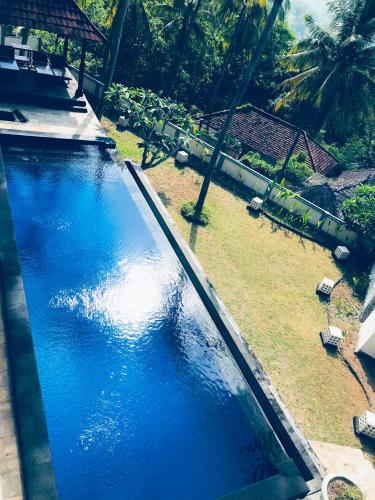 an overhead view of a swimming pool in a resort at Imaj Private Villas in Senggigi 