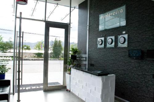 a restaurant with a door leading to a patio at Pontevedra Hotel Boutique in Paipa