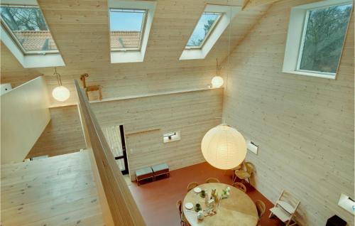 a room with a table and a ceiling with windows at Amazing Home In Sejerø With Kitchen in Sejerby