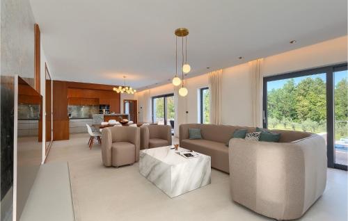 a living room with a couch and a table at Villa Istria Green in Kršan