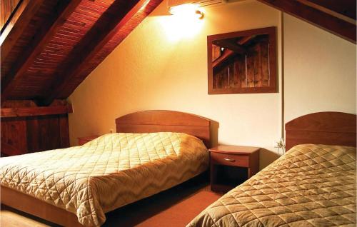 a hotel room with two beds and two night stands at Lovely Home In Podstrana in Podstrana