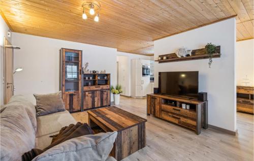 a living room with a couch and a tv at Ferienwohnung Altefähr in Altefähr